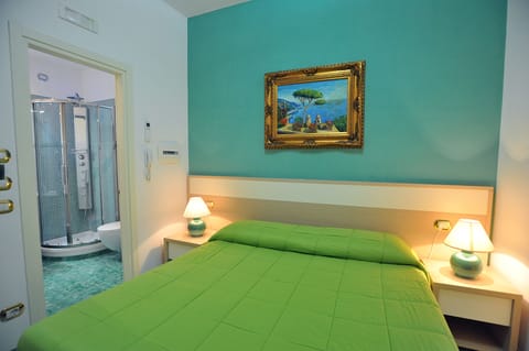 Economy Double Room | Minibar, in-room safe, individually furnished, desk