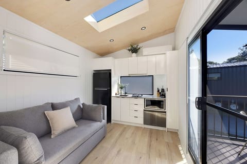 Premium Tiny Home - Sleeps 2 | Living area | 32-inch flat-screen TV with cable channels, LCD TV