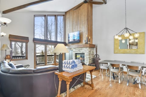 Deluxe Townhome | Living area | 60-inch flat-screen TV with cable channels, fireplace, Netflix