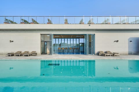 Outdoor pool, open 3:00 PM to 9:00 PM, sun loungers