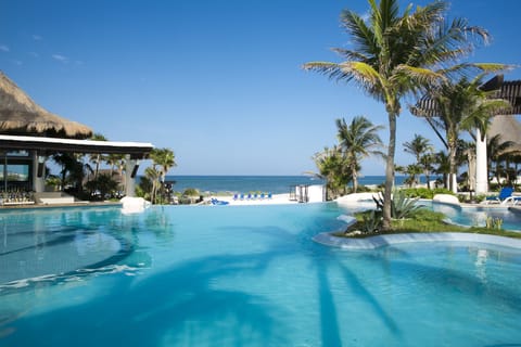 Outdoor pool, open 7:00 AM to 10:00 PM, pool umbrellas, sun loungers