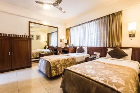 Executive Room | Pillowtop beds, minibar, in-room safe, individually decorated