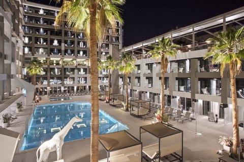 Outdoor pool, open 10:00 AM to 6:00 PM, pool umbrellas, sun loungers