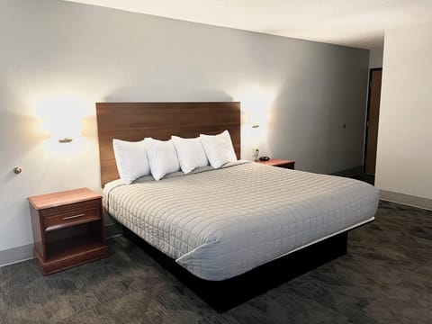 Desk, laptop workspace, blackout drapes, iron/ironing board