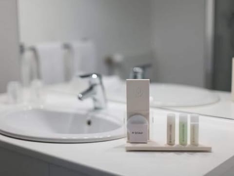 Shower, eco-friendly toiletries, hair dryer, towels