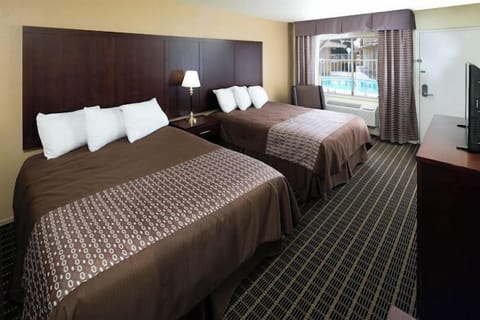 Room, 2 Queen Beds, Non Smoking | Blackout drapes, iron/ironing board, WiFi (free), bed sheets
