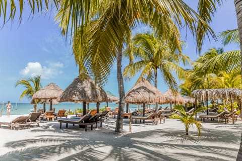 On the beach, white sand, sun loungers