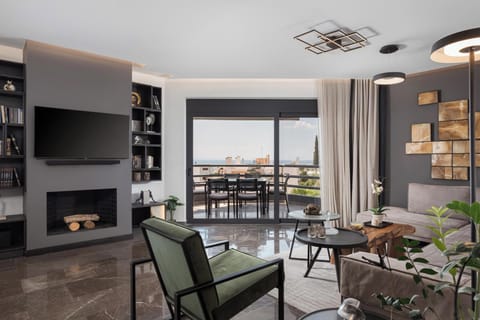Deluxe Apartment, 2 Bedrooms, Sea View | Living room | 50-inch Smart TV with digital channels, TV, Netflix