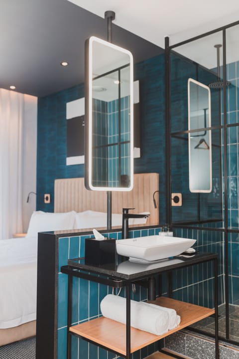 Shower, rainfall showerhead, hair dryer, towels