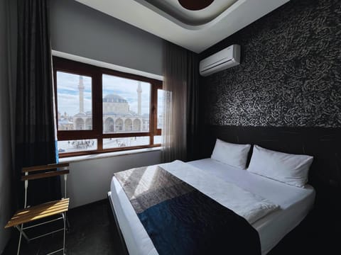 Deluxe Quadruple Room, City View | Soundproofing, free WiFi, bed sheets