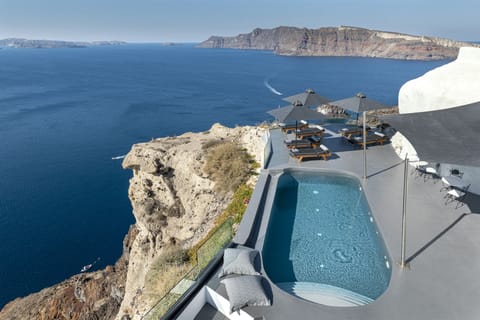 Seasonal outdoor pool, open 10:00 AM to 8:00 PM, pool umbrellas