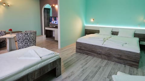 Quadruple Room | Minibar, desk, WiFi (free), individually decorated