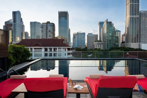 Outdoor pool, open 7:00 AM to 10:00 PM, pool umbrellas, sun loungers