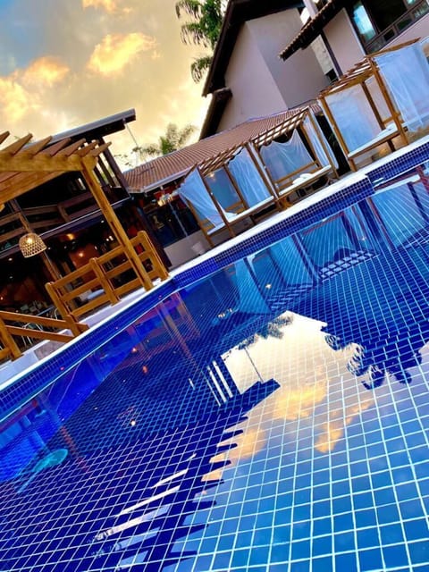 Indoor pool, outdoor pool, open 9:00 AM to 9:00 PM, pool umbrellas