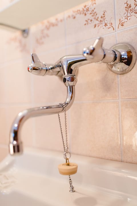 Shower, hair dryer, slippers, towels