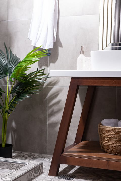 Shower, hair dryer, slippers, towels