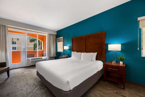 Desk, laptop workspace, blackout drapes, iron/ironing board