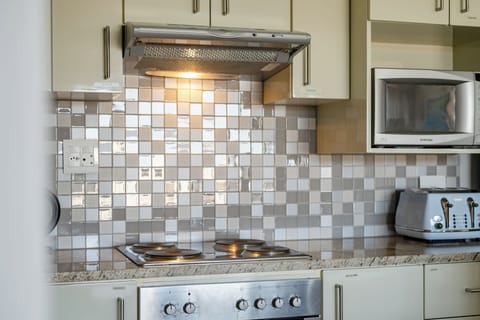 Village Residence | Private kitchen | Fridge, electric kettle