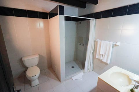 Junior Room | Bathroom | Shower, rainfall showerhead, towels, soap