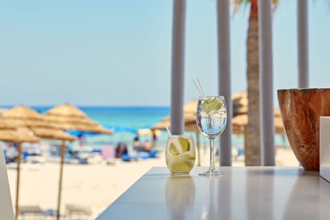 On the beach, white sand, sun loungers, beach umbrellas