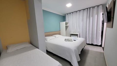 Triple Room | Minibar, individually decorated, desk, laptop workspace