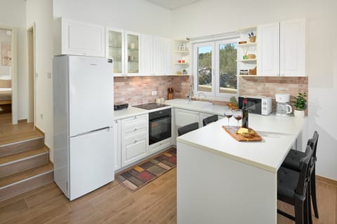 Villa, Pool Access, Partial Sea View | Private kitchen | Full-size fridge, microwave, oven, stovetop