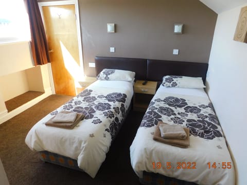 Twin Room, Ensuite (En suite Shower/Shared WC) | Blackout drapes, iron/ironing board, bed sheets