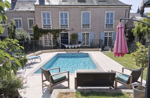 Seasonal outdoor pool, open 7:00 AM to 10:00 PM, pool umbrellas