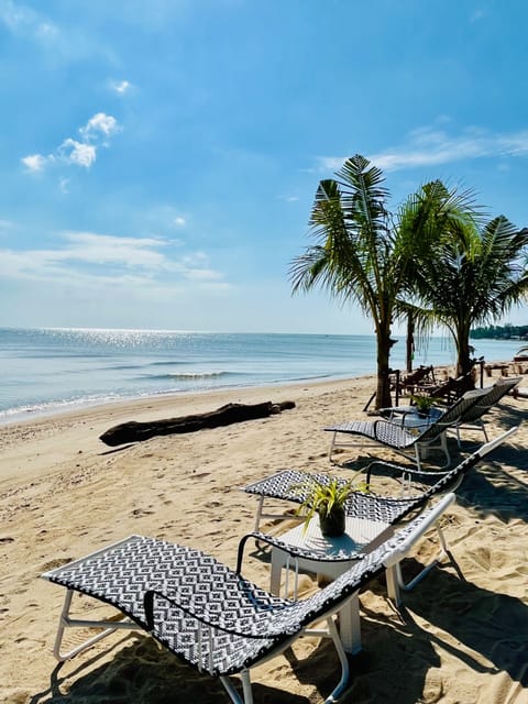 On the beach, sun loungers, beach umbrellas, beach towels