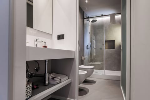 Shower, rainfall showerhead, designer toiletries, hair dryer