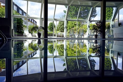 Indoor pool, open 6:00 AM to 10:00 PM, sun loungers