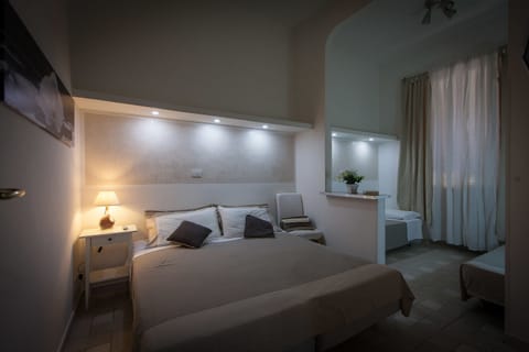 Family Quadruple Room, 1 Bedroom, Private Bathroom, City View | Down comforters, desk, blackout drapes, soundproofing