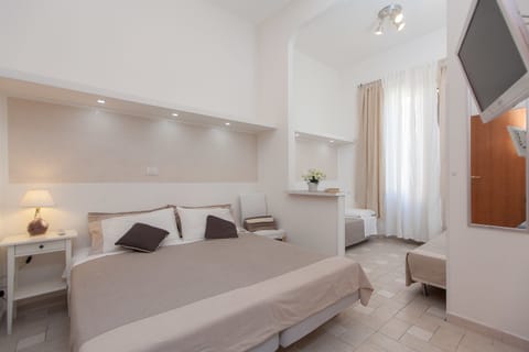 Family Quadruple Room, 1 Bedroom, Private Bathroom, City View | Down comforters, desk, blackout drapes, soundproofing