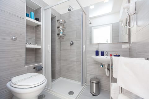 Shower, rainfall showerhead, hair dryer, towels