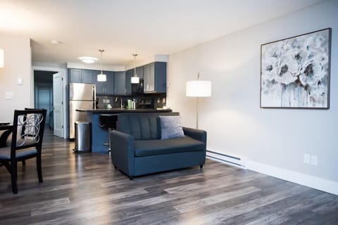 Premium Condo, 1 King Bed with Sofa bed, Garden Area | Living area | TV, fireplace, table tennis