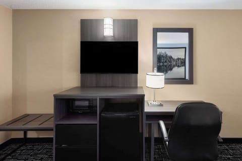 Desk, laptop workspace, blackout drapes, iron/ironing board