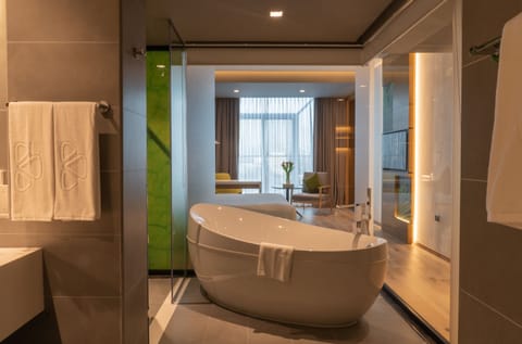 Courtyard Suite | Bathroom | Slippers, bidet, towels, soap