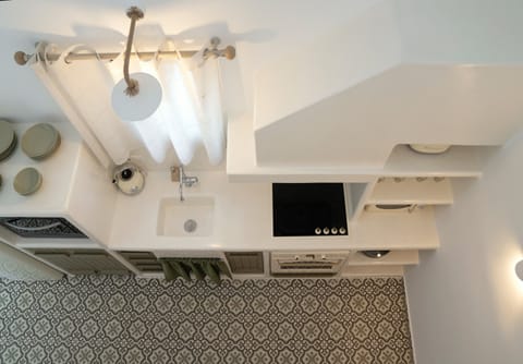 Suite, Private Pool | Private kitchen | Microwave, stovetop, electric kettle, toaster