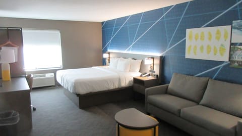 Premium bedding, desk, laptop workspace, blackout drapes
