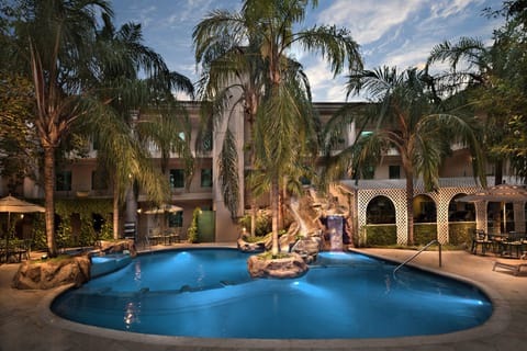 Outdoor pool, open 7:00 AM to 10:00 PM, sun loungers