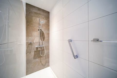 Studio Suite | Bathroom | Hair dryer, towels, toilet paper