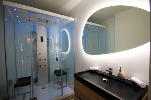 Luxury Studio Suite, 1 King Bed | Bathroom | Separate tub and shower, jetted tub, hydromassage showerhead, hair dryer