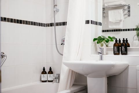 Combined shower/tub, hair dryer, towels, soap