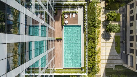 Seasonal outdoor pool, open 8:00 AM to 8:00 PM, pool umbrellas