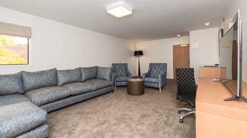 Suite, King Bed | Living area | 49-inch LCD TV with cable channels, TV