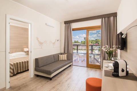 In-room safe, desk, laptop workspace, bed sheets