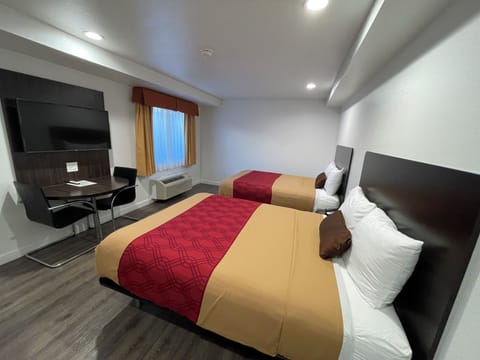 Pillowtop beds, desk, laptop workspace, free WiFi