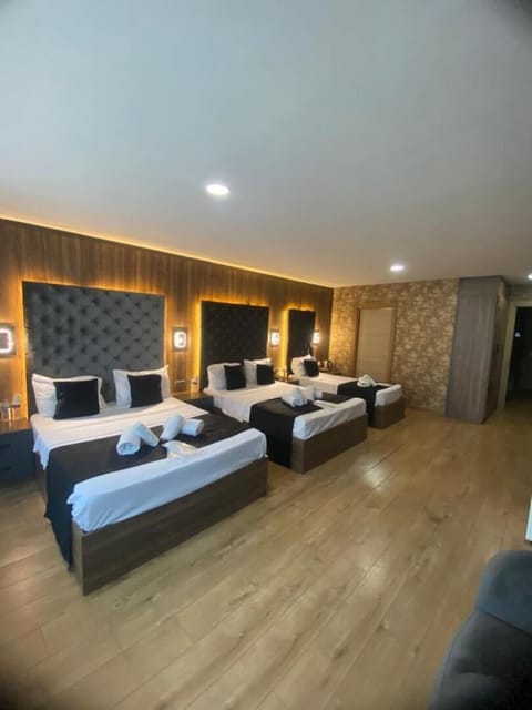 Premium bedding, desk, laptop workspace, soundproofing