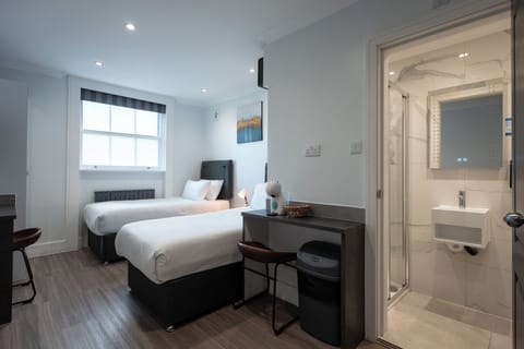 Junior Twin Studio | Iron/ironing board, cribs (free), WiFi (free), bed sheets