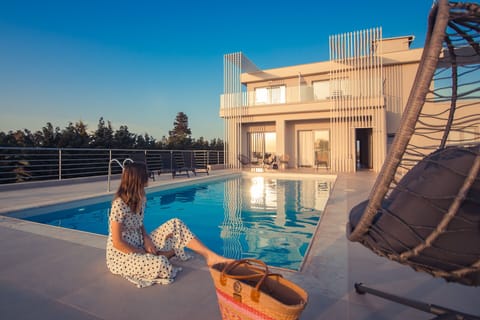 Seasonal outdoor pool, open 8:30 AM to 8:30 PM, pool umbrellas